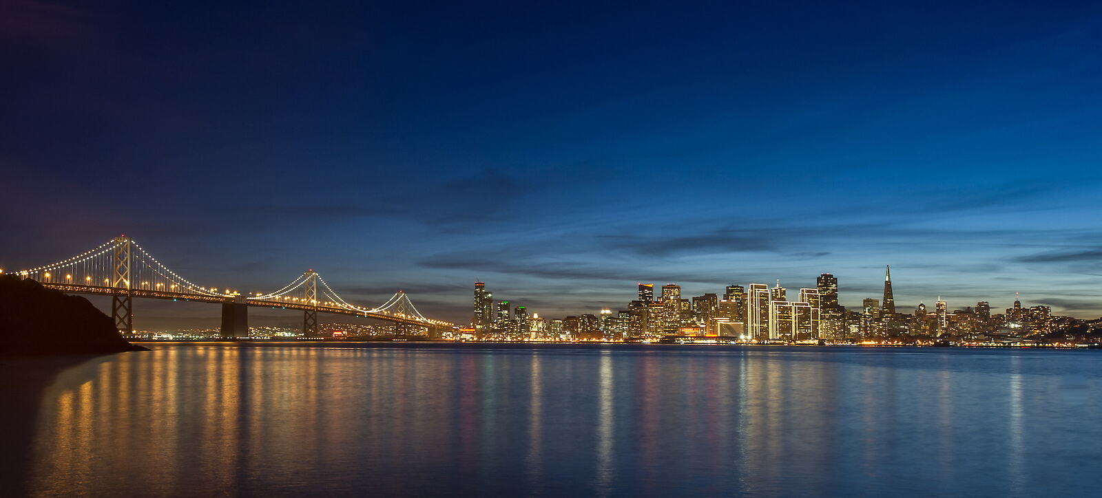 The Bay Bridge and the San Francisco skyline at night