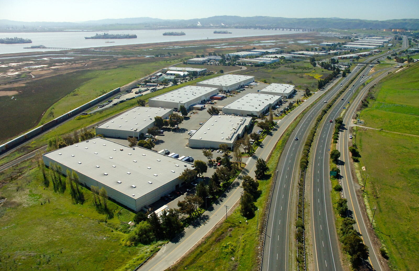 Aerial view of warehouses and a highway in Benicia